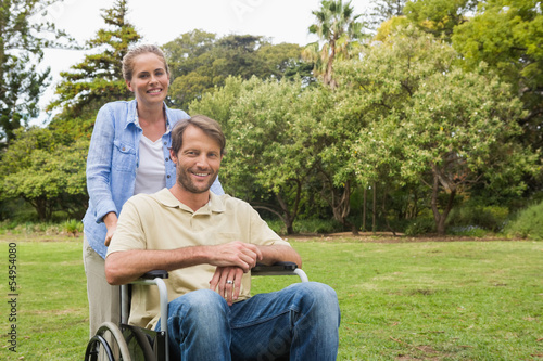 Smiling man in wheelchair with partner © WavebreakmediaMicro