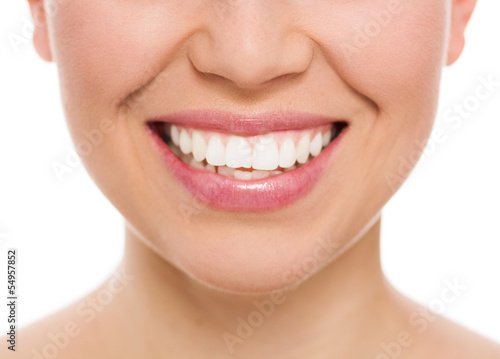 Dental care woman. Female with white teeth smiling, isolated