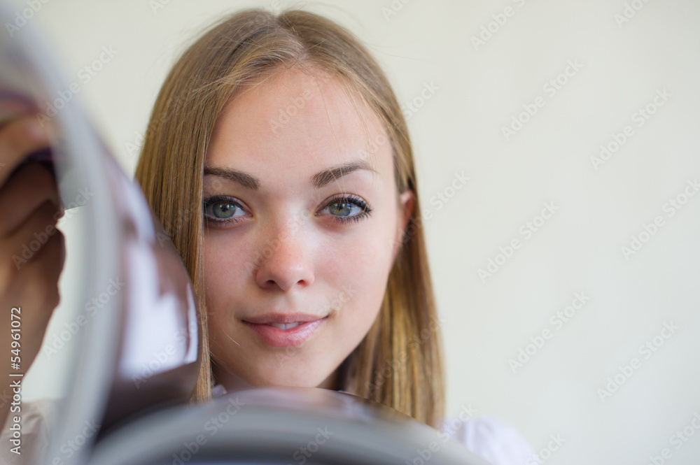 girl considers the magazine