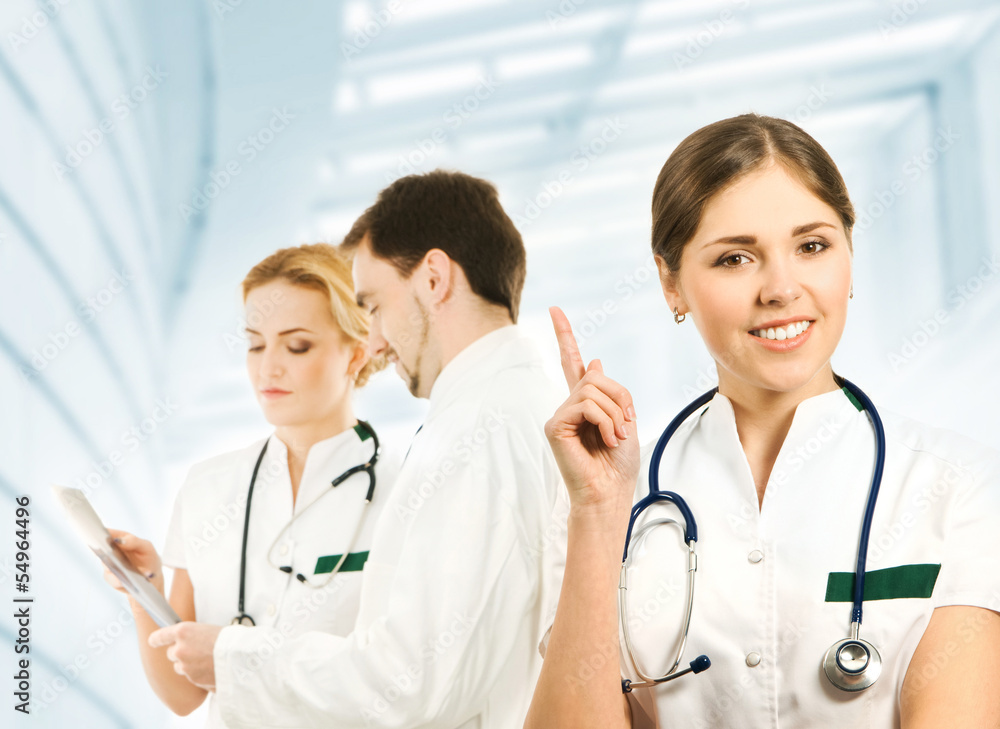A team of young and smart medical workers in white clothes A team of young and smart medical workers in white clothes