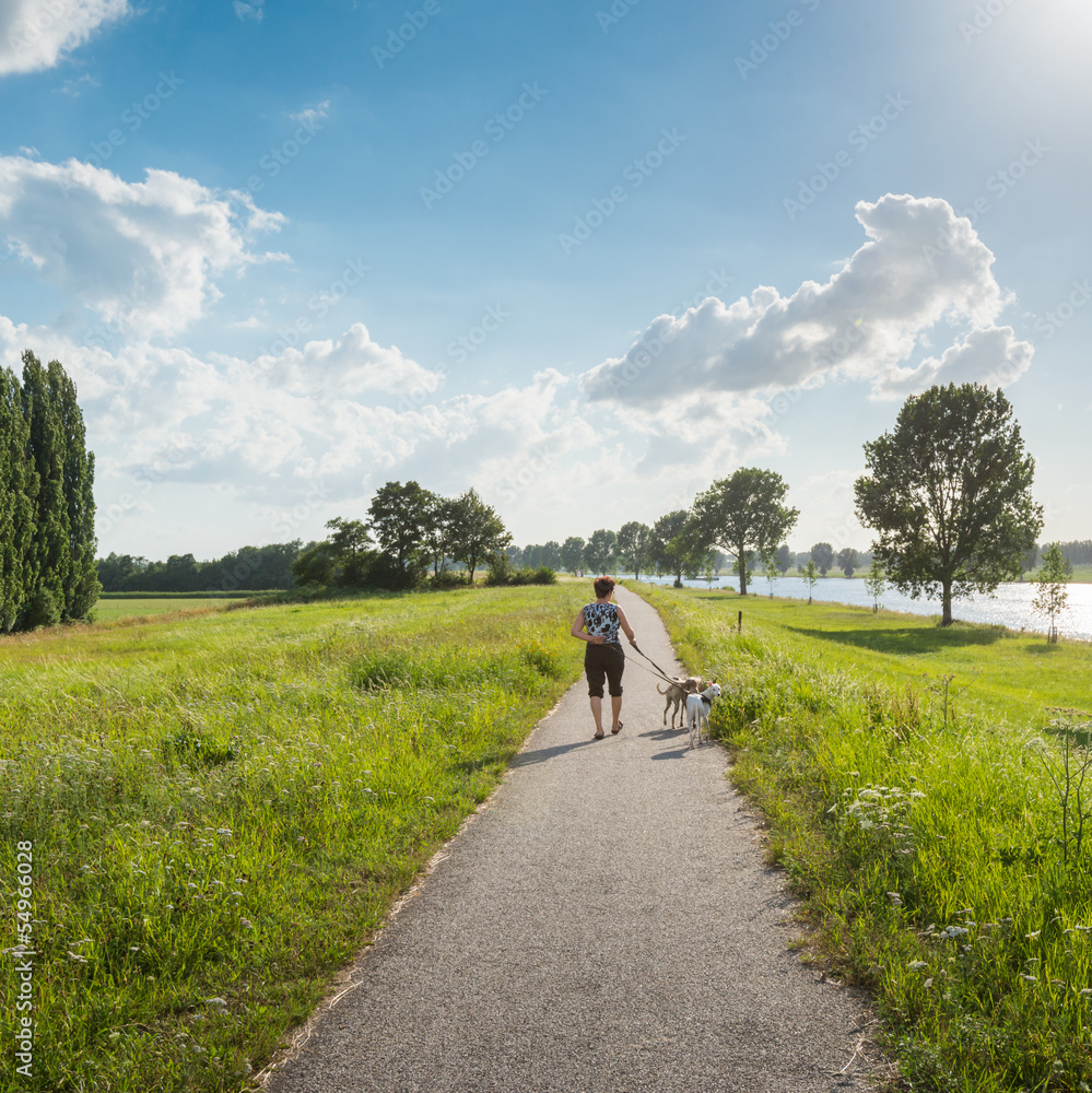 Obraz premium Walking along the river