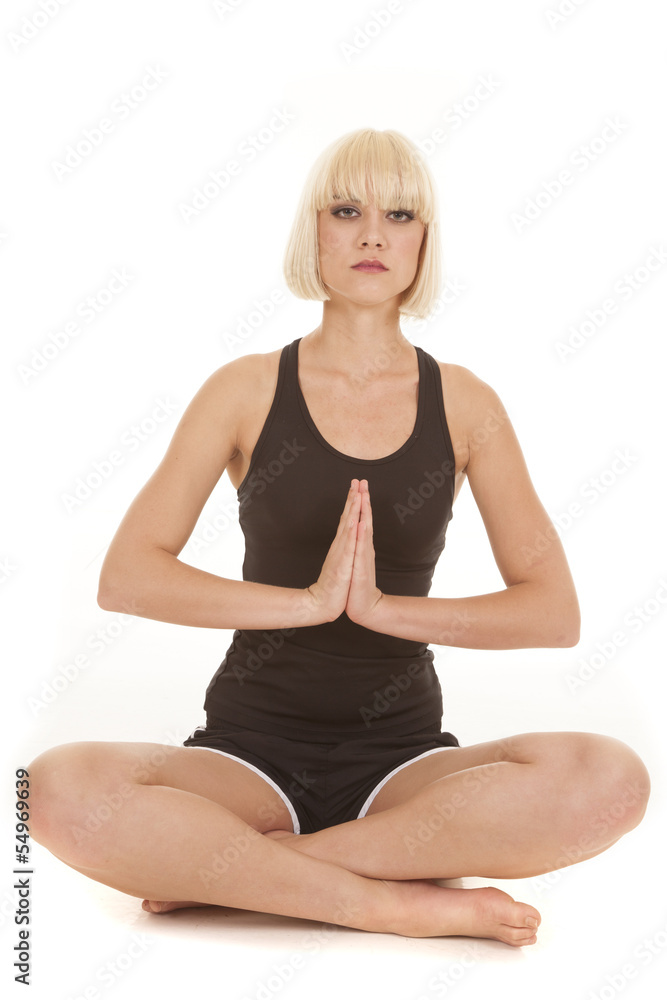 woman black fitness outfit meditate facing serious woman black fitness outfit meditate facing serious