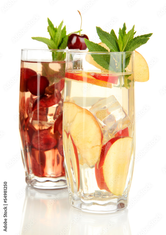 Glasses of fruit drinks with ice cubes isolated on white Glasses of fruit drinks with ice cubes isolated on white