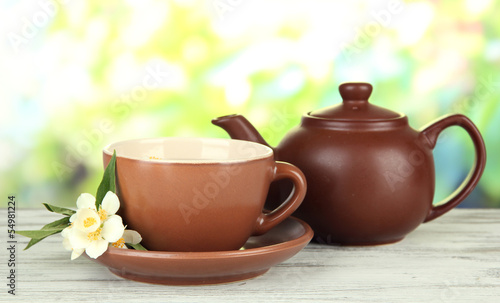 Cup of tea with jasmine, on bright background