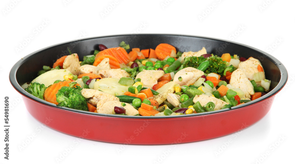 Casserole with vegetables and meat on pan, isolated on white