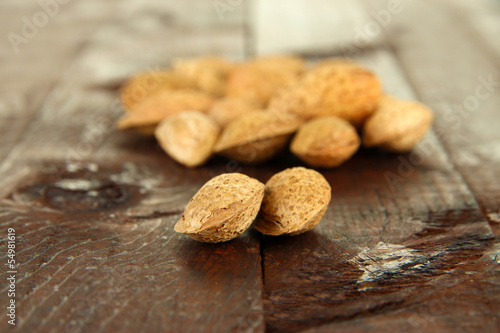 Almond on dark wooden background