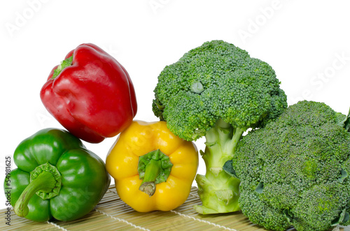 Colored paprika (pepper) and Broccoli on a white background