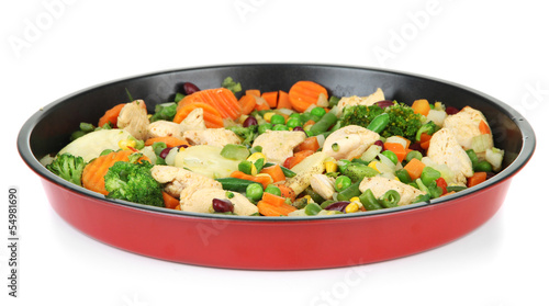 Casserole with vegetables and meat on pan, isolated on white