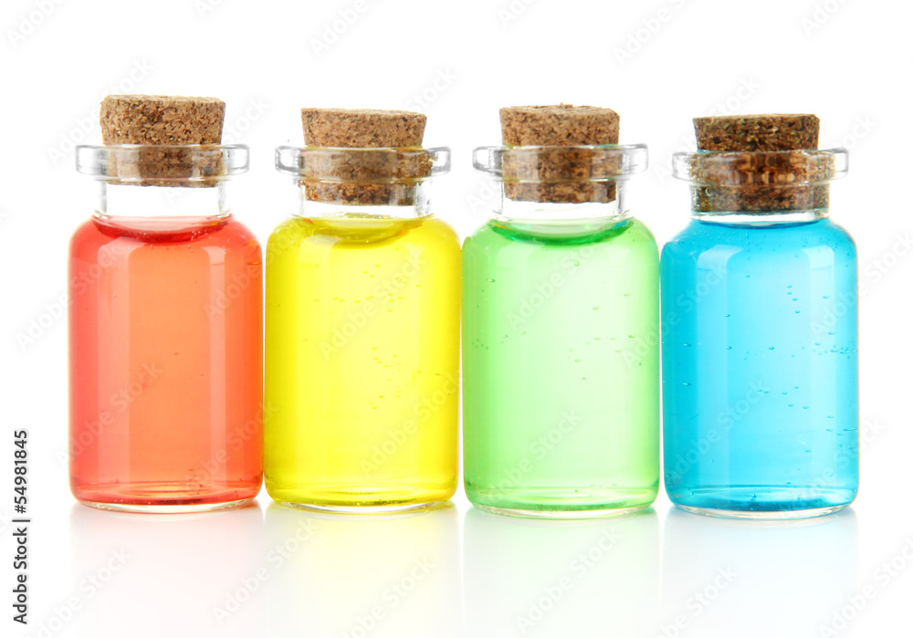 Bottles with colored liquids isolated on white Bottles with colored liquids isolated on white
