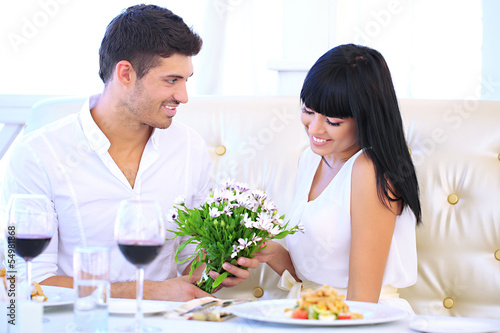 Beautiful couple having  romantic dinner at restaurant