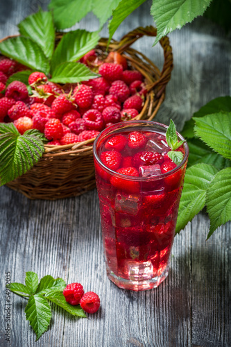 Juice from freshly harvested raspberries with ice