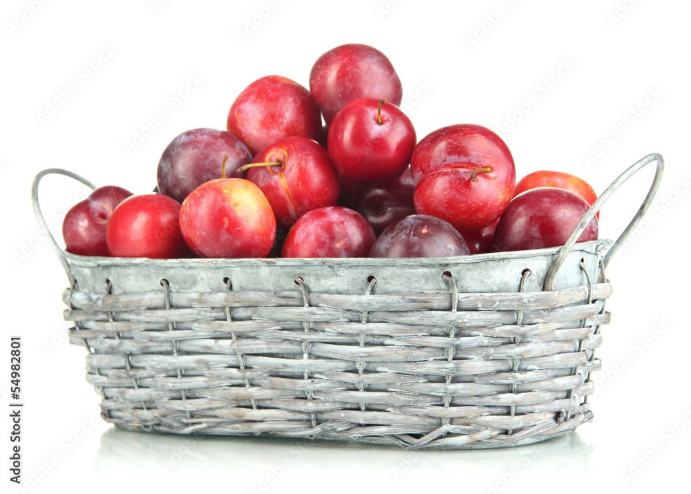 Ripe plums in basket isolated on white Ripe plums in basket isolated on white