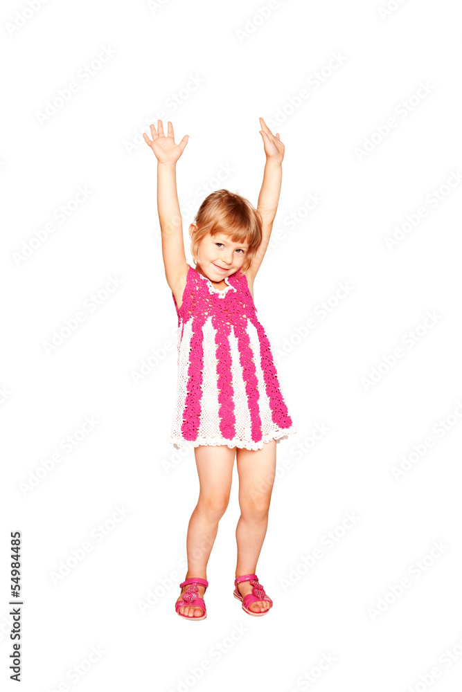 Happy little girl in a knitted dress dancing Happy little girl in a knitted dress dancing