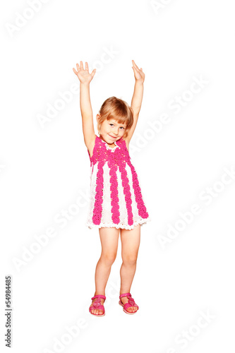 Happy little girl in a knitted dress dancing
