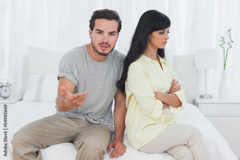 Woman sulking and her boyfriend doesnt know what to do Woman sulking and her boyfriend doesnt know what to do