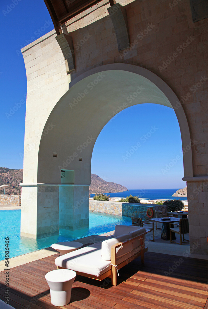 Vertical view of arch pool terrace on summer resort (Greece)