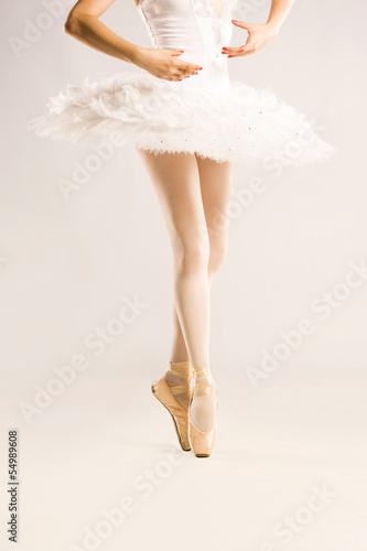 Beauty legs of ballerina on white