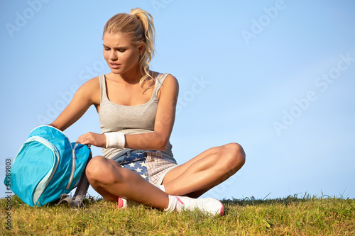 A woman resting after training © ZoomTeam