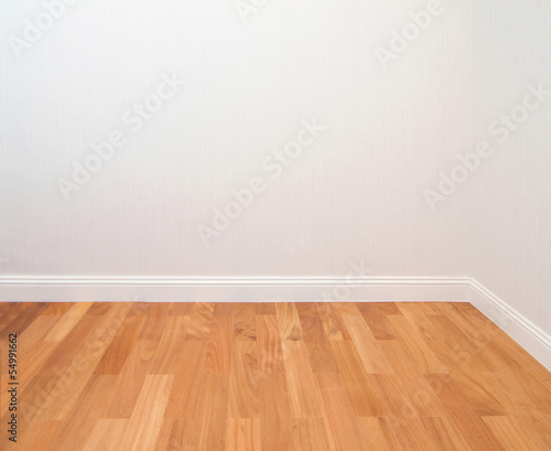 Empty space with wall and wooden floor