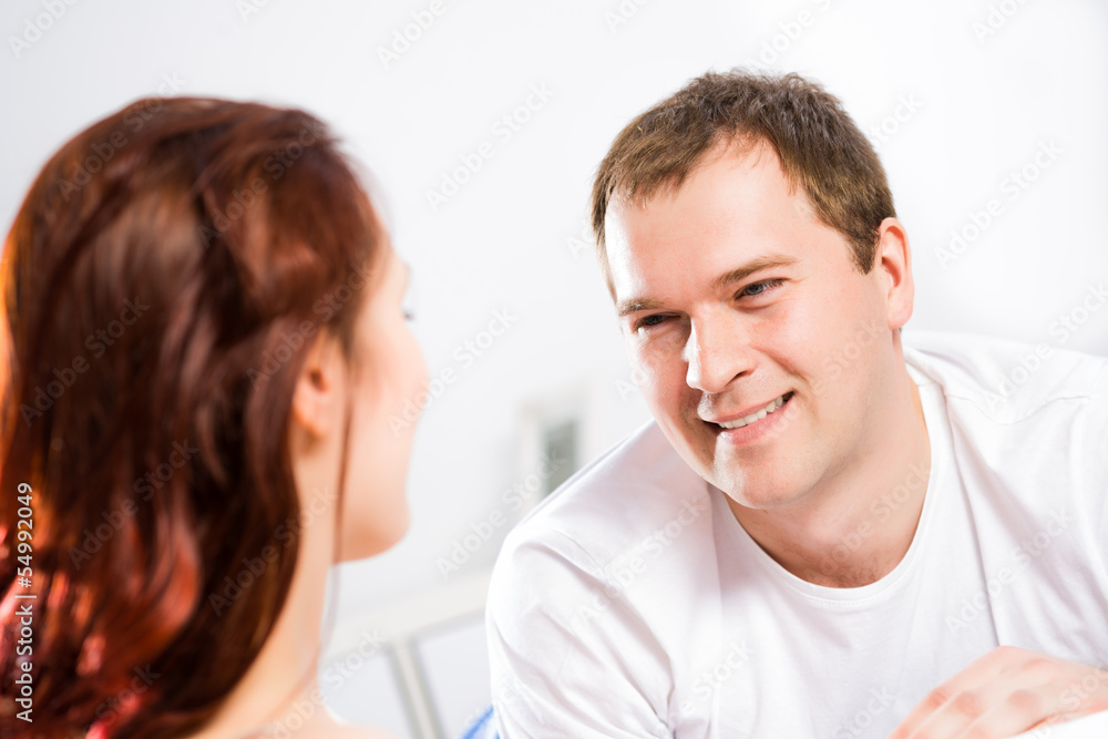 young man lying in bed with his girlfriend young man lying in bed with his girlfriend
