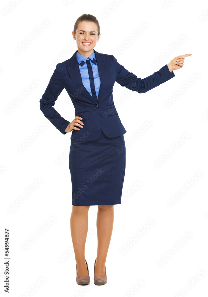 Smiling business woman pointing on copy space Smiling business woman pointing on copy space