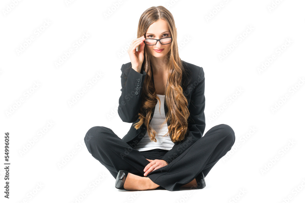 Young business woman with glasses scrutinizing Young business woman with glasses scrutinizing