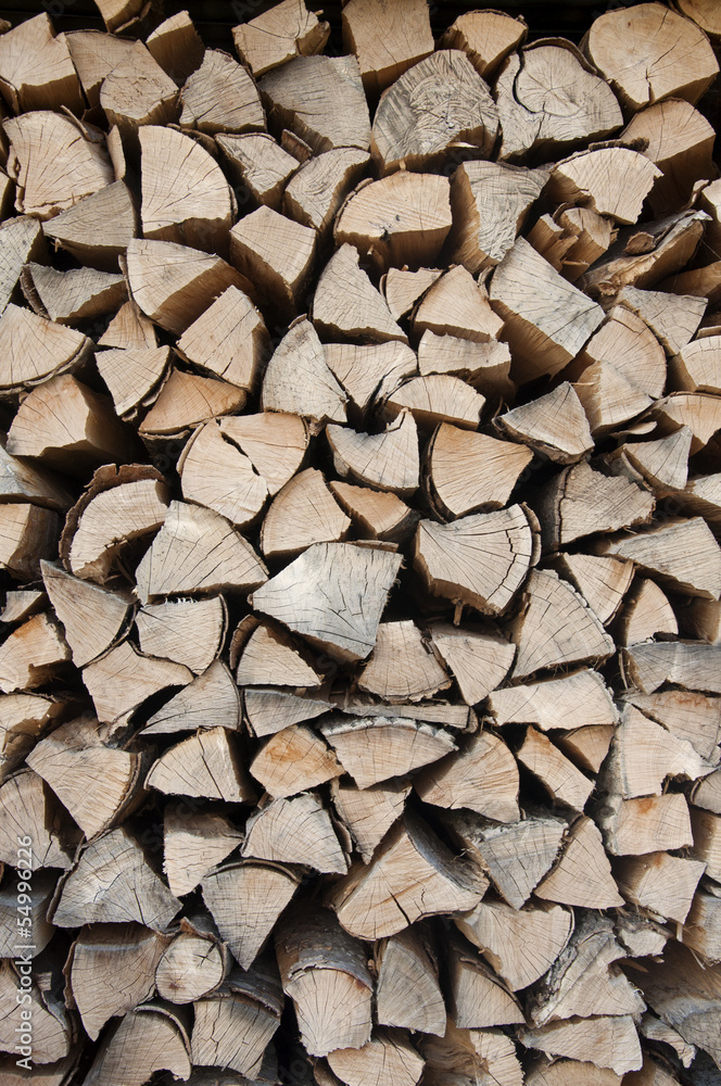 Logs of wood stacked in Vevey, Switzerland Logs of wood stacked in Vevey, Switzerland