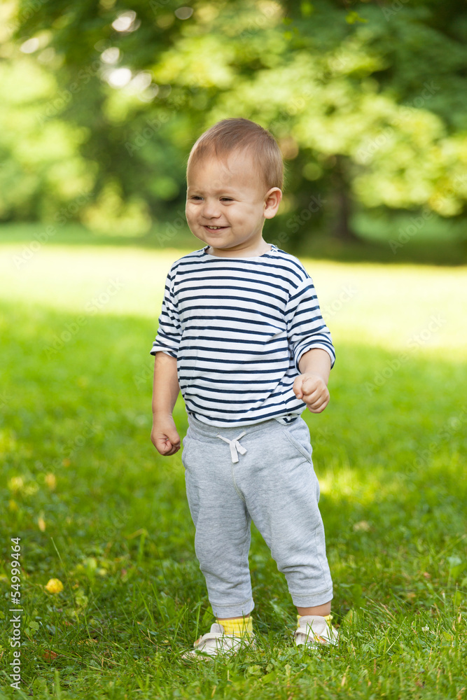 little boy walks in the summer on a solar clearing little boy walks in the summer on a solar clearing