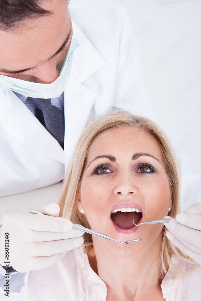 Dentist Examining Patient Dentist Examining Patient