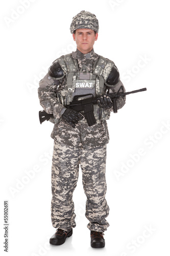 Portrait Of Solider Holding Rifle