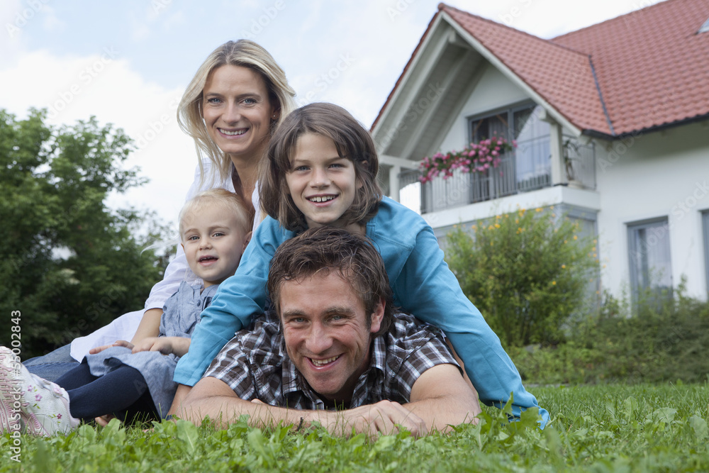 Germany, Munich, Family in front of house, smiling, portrait Germany, Munich, Family in front of house, smiling, portrait