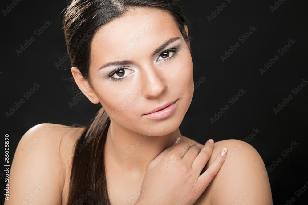 A portrait of a beautiful woman isolated on black background A portrait of a beautiful woman isolated on black background