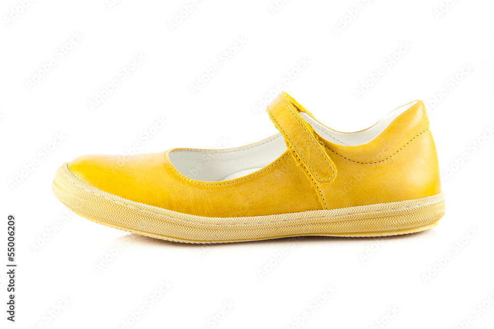 Children's shoes isolated over the white background. yellow sh Children's shoes isolated over the white background. yellow sh