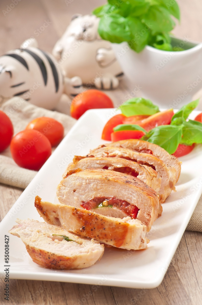 Grilled chicken breast stuffed with basil, tomato and garlic
