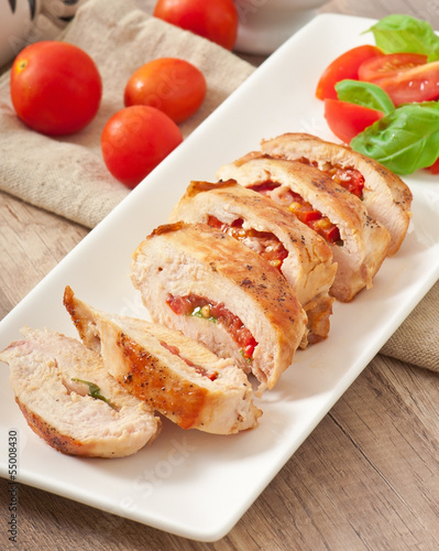 Grilled chicken breast stuffed with basil, tomato and garlic