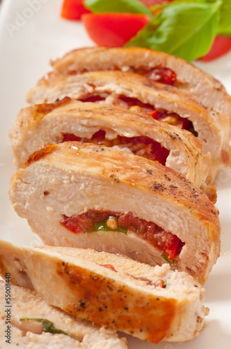 Grilled chicken breast stuffed with basil, tomato and garlic