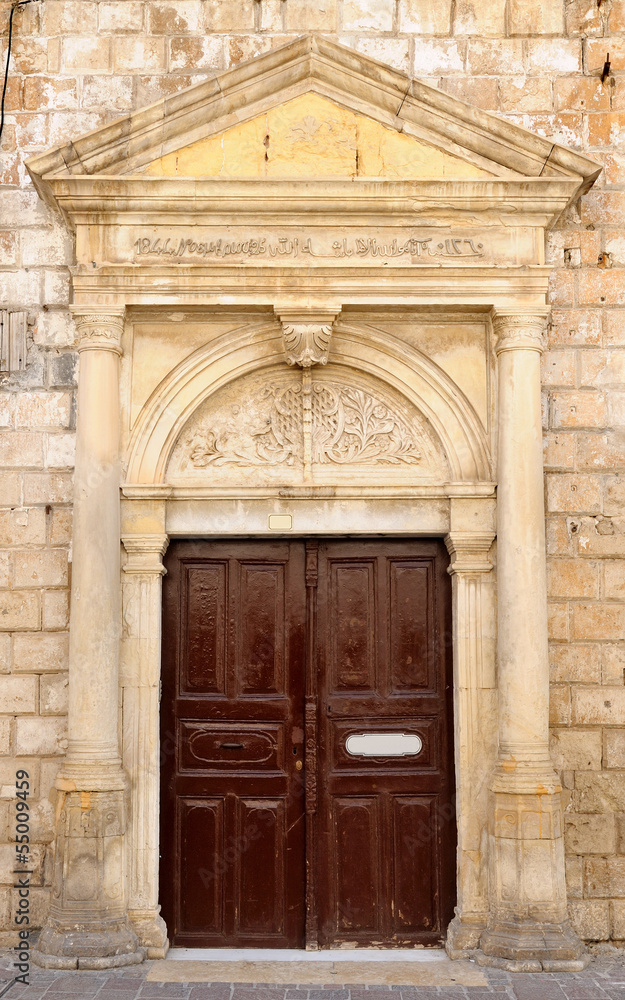 Old venetian door facade in city of Rethymno, Crete, Greece