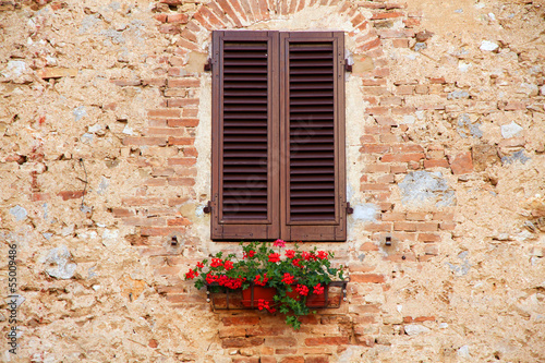 Window on the Facade of Italian stone wall