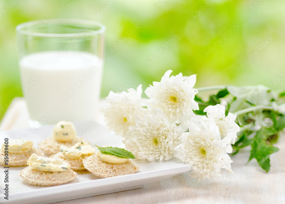 Several canapes and glass of milk Several canapes and glass of milk