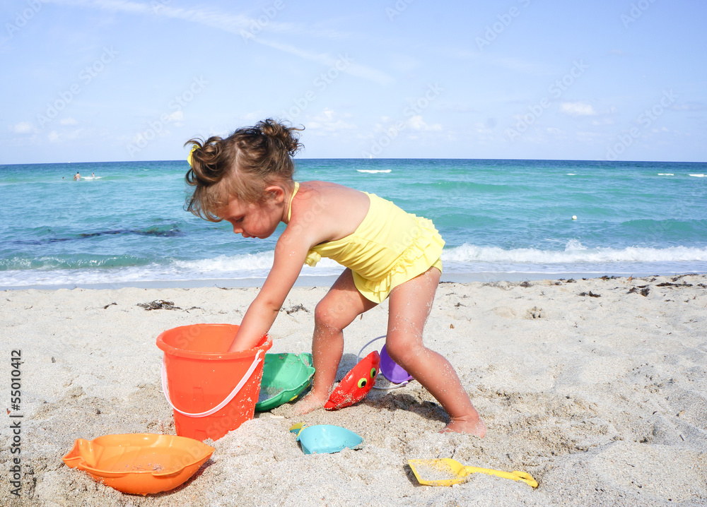 baby girl is having fun at the beach baby girl is having fun at the beach