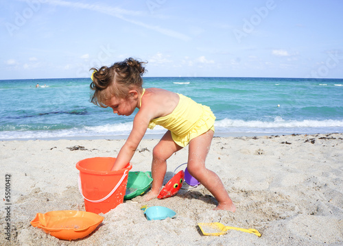 baby girl is having fun at the beach © ehaurylik