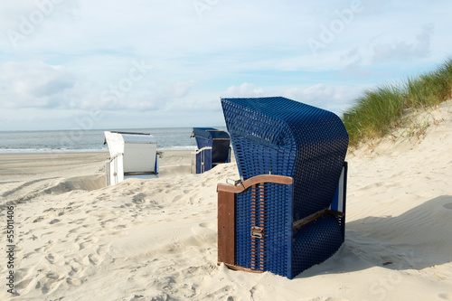 Borkum beach with blue and white chairs