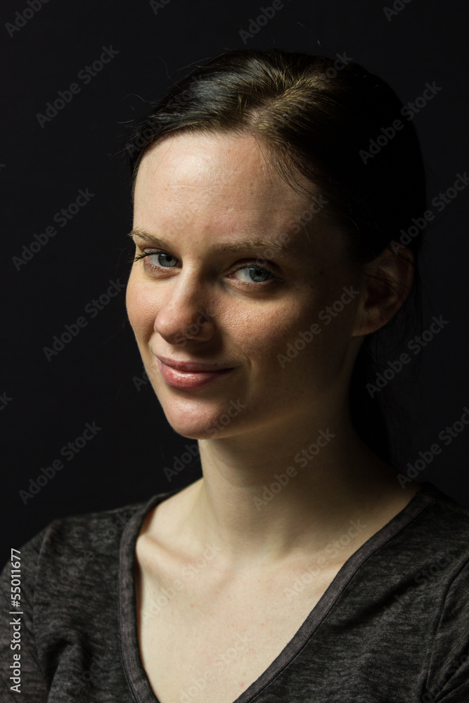 Young woman smiling at camera, vertical Young woman smiling at camera, vertical