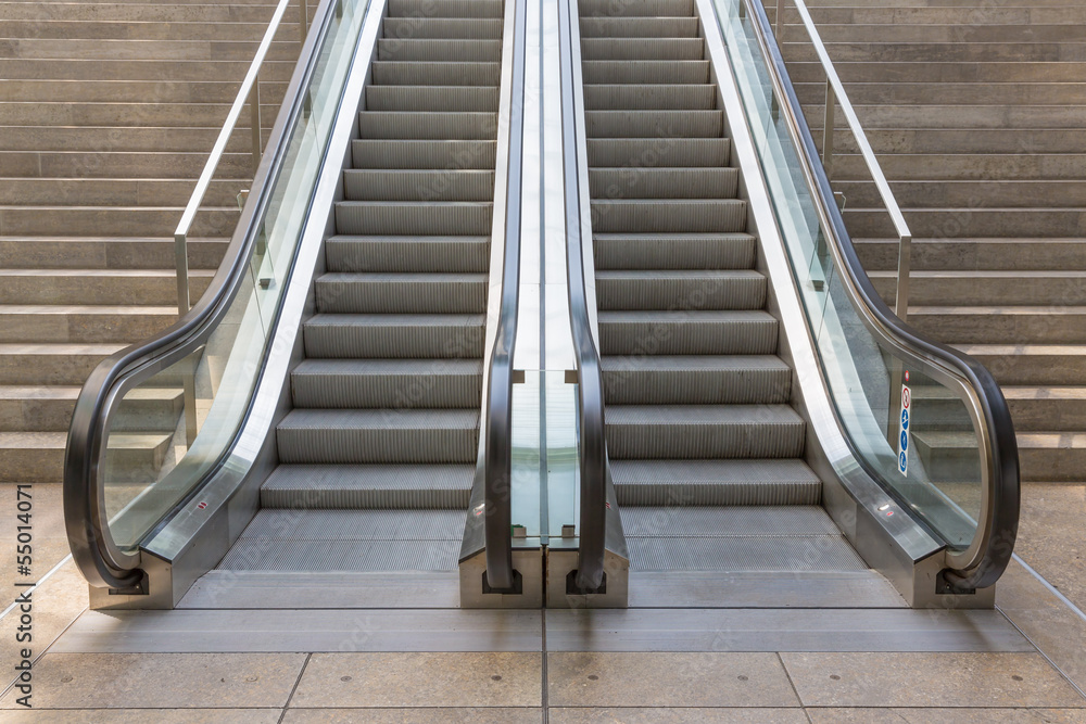 Stone stairs with elevator in modern building Stone stairs with elevator in modern building