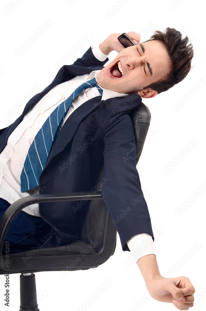 Tiered business man yawning in the executive chair. Tiered business man yawning in the executive chair.