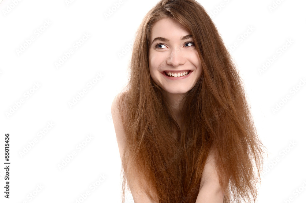 Goofy girl with hair not brushed smiling looking to the side Goofy girl with hair not brushed smiling looking to the side