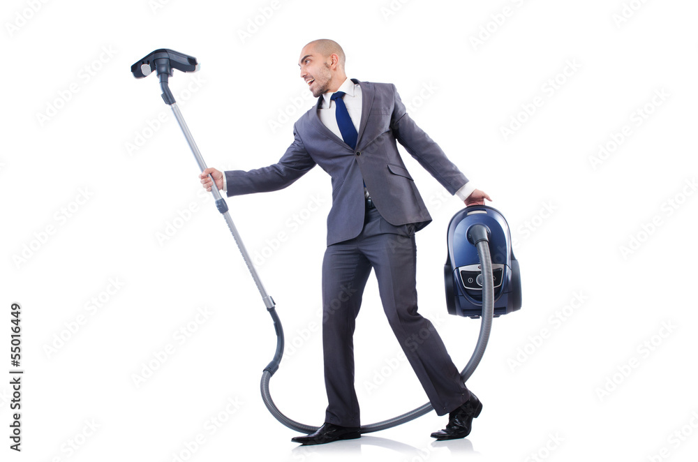 Businessman doing vacuum cleaning on white Businessman doing vacuum cleaning on white