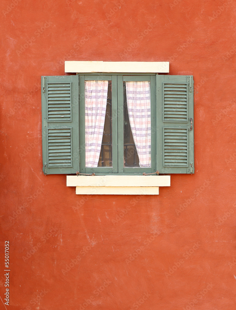Vintage window on cement wall