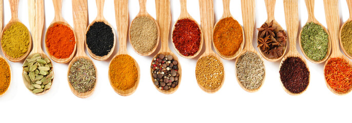 Fototapete Gewürze Assortment of spices in wooden spoons, isolated on white  © Africa Studio