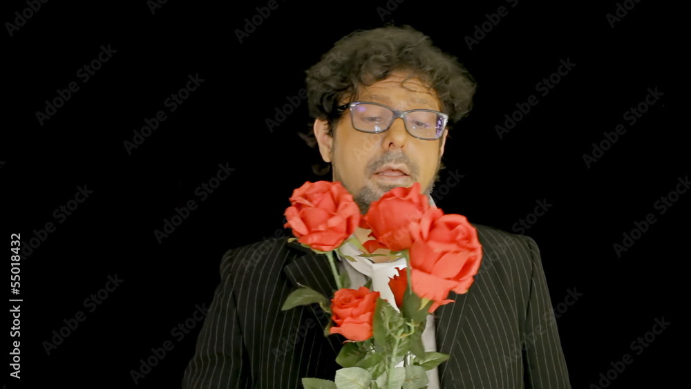 Old man offering red roses Old man offering red roses